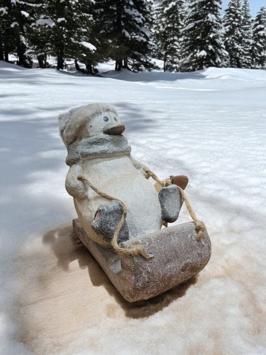 Sledding Penguin Statues